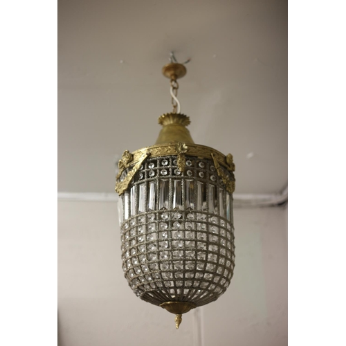 607 - A CONTINENTAL GILT BRASS AND CUT GLASS CENTRE LIGHT of cylindrical tapering form inset with faceted ... 