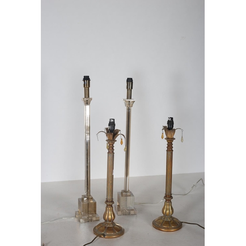 612 - A PAIR OF GLAZED TABLE LAMPS each with a square column above a stepped base (AF) together with a pai... 