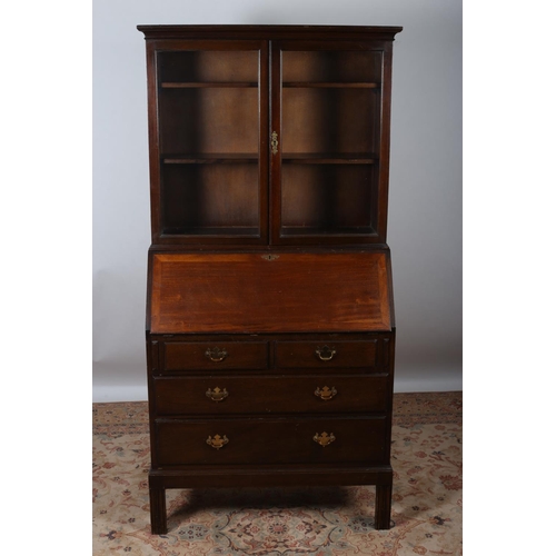 624 - A GEORGIAN DESIGN MAHOGANY BUREAU BOOKCASE the moulded cornice above a pair of glazed doors containi... 