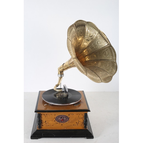 639 - AN EBONISED AND PAINTED PINE CASE GRAMOPHONE with brass embossed horn inscribed Gramophone Sound Mas... 