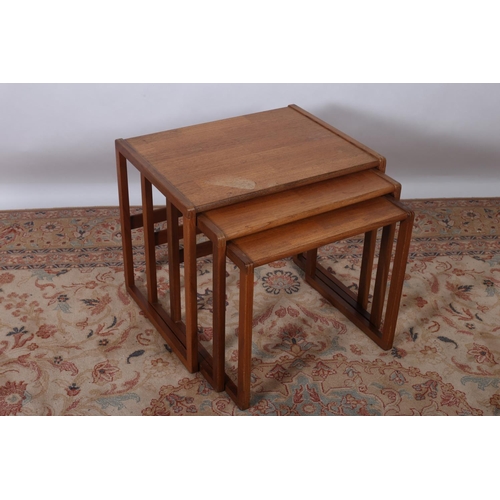 641 - A VINTAGE G-PLAN TEAK NEST OF THREE TABLES each of rectangular outline on moulded legs joined by cro... 