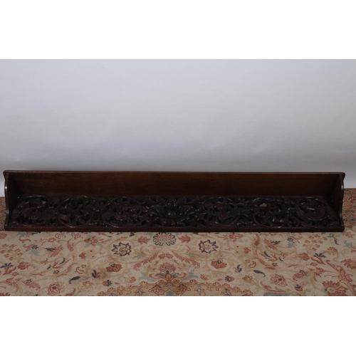 642 - A CARVED OAK WALL MOUNTED COAT HANGER of rectangular form with moulded shelf above a pierced carved ... 