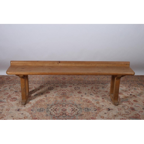 643 - A VINTAGE PINE BENCH of rectangular outline on moulded supports and platform base 54cm (h) x 170cm (... 