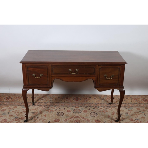 646 - A MAHOGANY DESK of rectangular outline the shaped top with three frieze drawers on cabriole legs wit... 