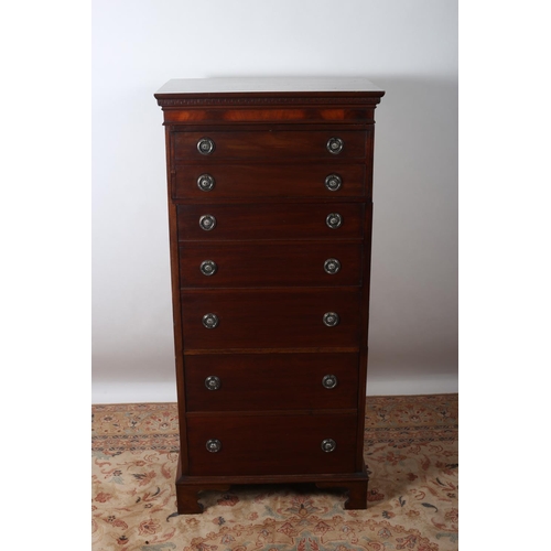 68 - A HEPPLEWHITE DESIGN MAHOGANY TALLBOY of rectangular outline the shaped top above a dentil moulded c... 