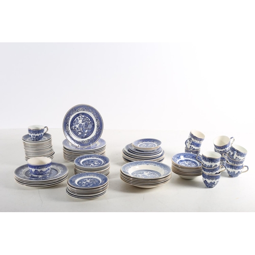 73 - TWO MATCHED SETS OF ARKLOW POTTERY WILLOW PATTERN DINNER AND TEA SERVICE together with four odd piec... 