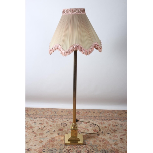 76 - A BRASS CORINTHIAN COLUMN FLOOR STANDING LAMP the reeded column above a square stepped base with ple... 