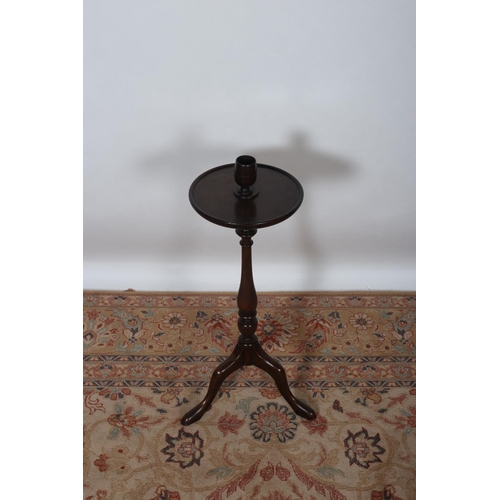 84 - A MAHOGANY STAND the circular dish top with container above a baluster column on tripod support 70cm... 