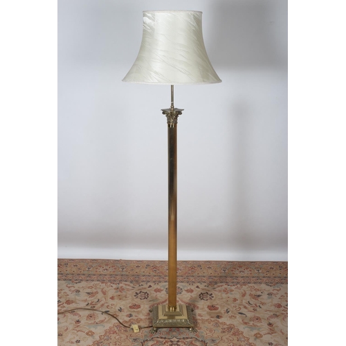 88 - A BRASS CORINTHIAN COLUMN FLOOR STANDING LAMP the reeded column raised on a square stepped base with... 