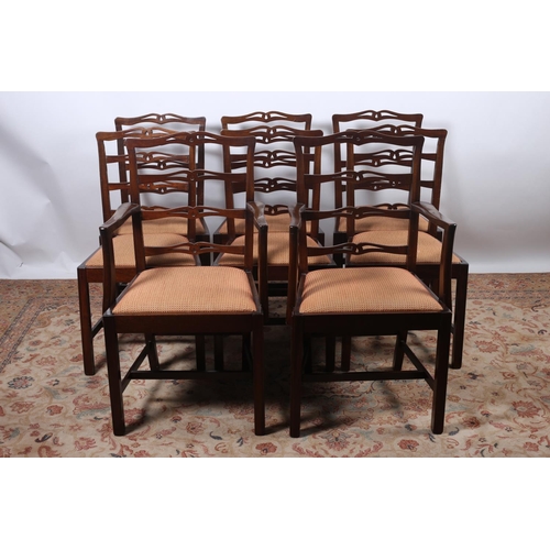 93 - A SET OF EIGHT LADDER BACK DINING CHAIRS including a pair of elbow chairs each with horizontal pierc... 