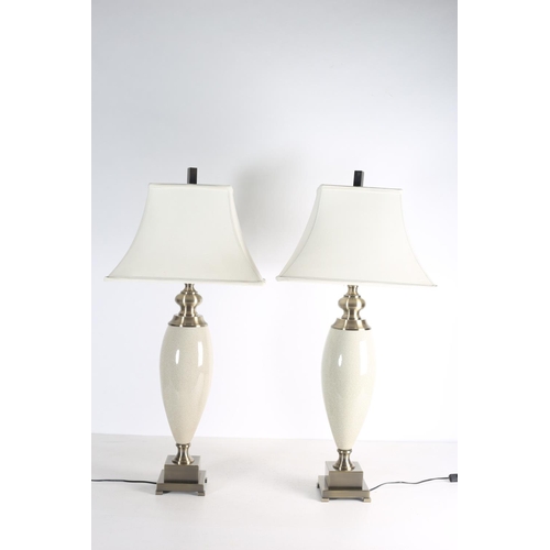 96 - A PAIR OF BRASS OXIDISED AND GLAZED CHINA TABLE LAMPS each of ovoid tapering form raised on a square... 