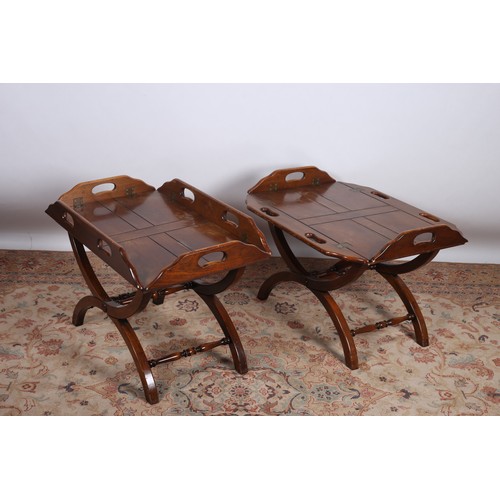 653 - A PAIR OF MAHOGANY BUTLER'S TRAYS ON STANDS each of rectangular form with hinged sides and carrying ... 