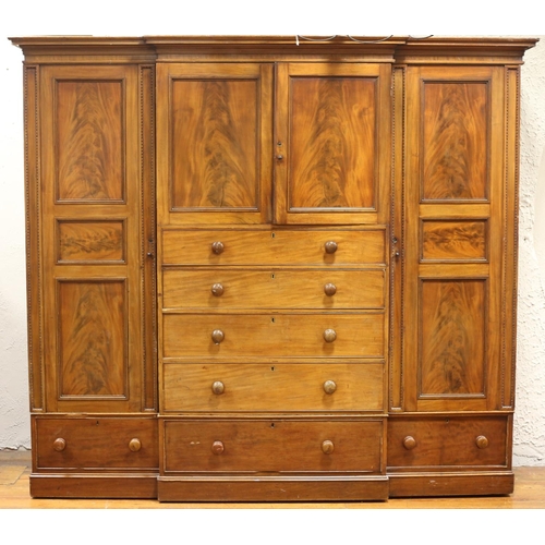45 - A GOOD 19TH CENTURY MAHOGANY COMBINATION WARDROBE of breakfront outline the moulded cornice above a ... 