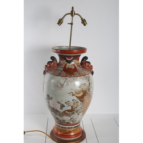 63 - A FINE 19TH CENTURY JAPANESE TABLE LAMP of urn form the white and rust ground decorated with figures... 