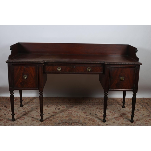 28 - A REGENCY MAHOGANY SIDEBOARD of inverted breakfront outline the shaped top with moulded three quarte... 