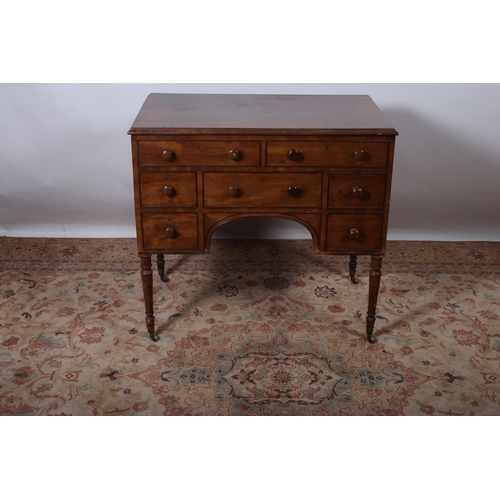 14 - A 19TH CENTURY MAHOGANY DESK the rectangular hinged top containing a fitted interior with lidded com... 