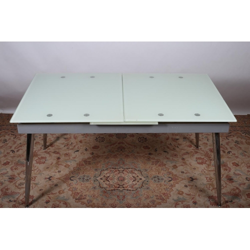 25 - A CONTINENTAL DESIGNER CHROME AND GLAZED DINING TABLE of rectangular outline the glazed top raised o... 
