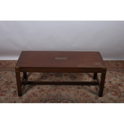 28 - A STAINED WOOD AND BRASS BOUND COFFEE TABLE of rectangular outline raised on square moulded legs 43c... 