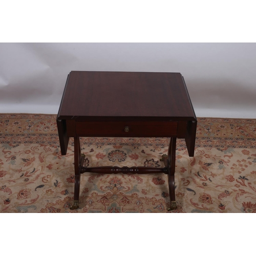 41 - A MAHOGANY DROP LEAF TABLE the rectangular hinged top with frieze drawer on lyre end standard suppor... 