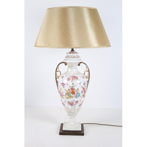 52 - A CONTINENTAL PORCELAIN TABLE LAMP of vase form the white and gilt ground with painted panel depicti... 