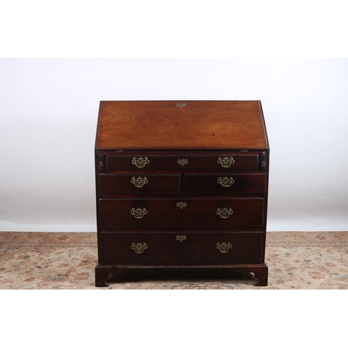 70 - A GOOD GEORGIAN MAHOGANY BUREAU the rectangular hinged top containing pigeon holes and drawers above... 