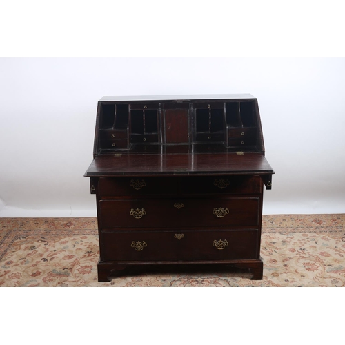 70 - A GOOD GEORGIAN MAHOGANY BUREAU the rectangular hinged top containing pigeon holes and drawers above... 