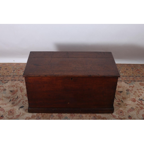 78 - A VINTAGE OAK TRUNK of rectangular outline the hinged top with vacant interior on platform base 42cm... 