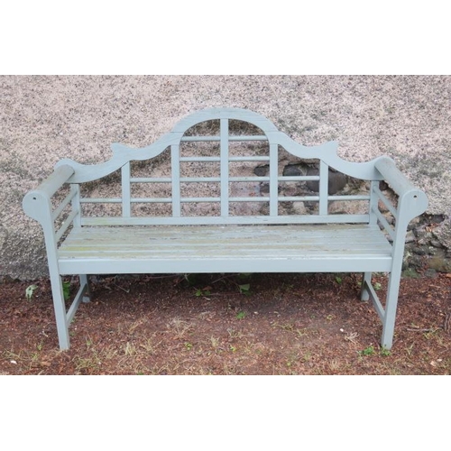 798 - A TEAK PAINTED GARDEN SEAT the rectangular arched back with cylindrical barring above a slatted seat... 