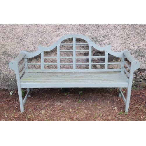 799 - A TEAK PAINTED GARDEN SEAT the rectangular arched back with cylindrical barring above a slatted seat... 