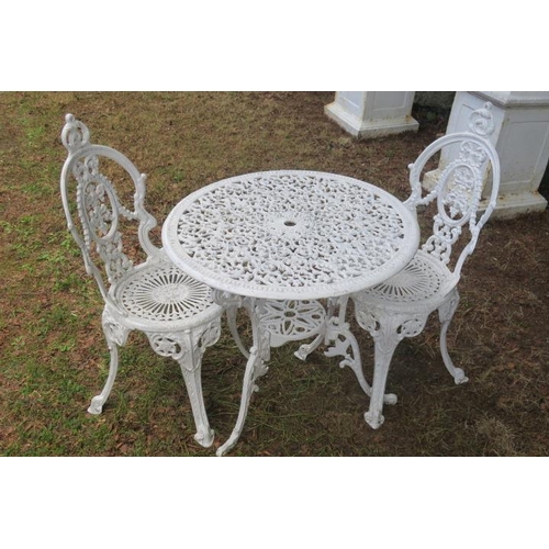 800 - A CAST METAL THREE PIECE PATIO SUITE comprising circular table with pierced C-scroll decoration rais... 