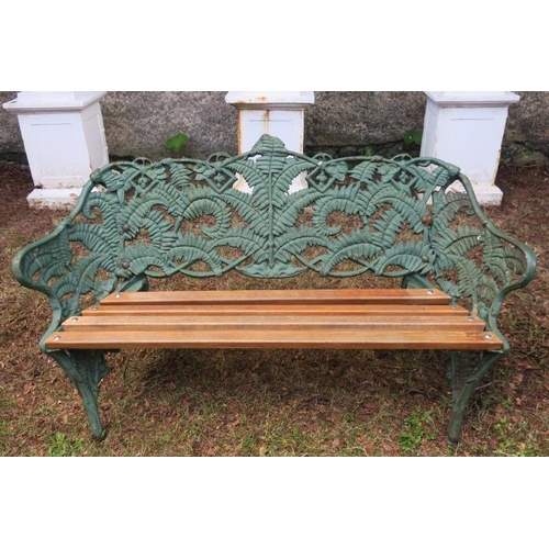 808 - A CAST IRON FERN BACK GARDEN SEAT with teak slatted seat on rustic legs 81cm (h) x 150cm (w) x 50cm ... 