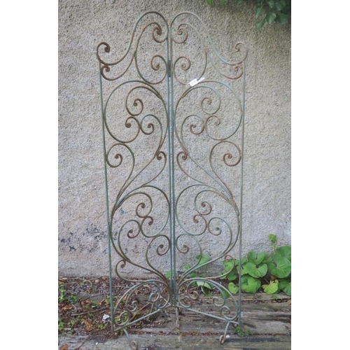 814 - A WROUGHT IRON TWOFOLD FOLDING SCREEN with scroll decoration on scroll legs 198cm (h) x 196cm (w)