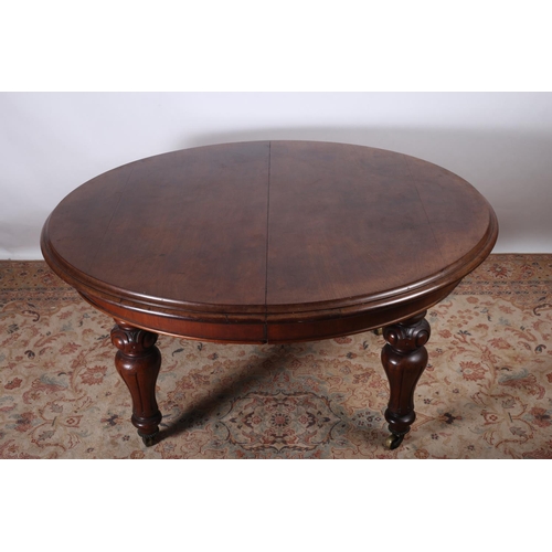 82 - A 19TH CENTURY MAHOGANY TELESCOPIC DINING TABLE of rectangular outline with rounded ends and three l... 