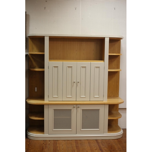 83 - A MODERN TEAK AND GREY PAINTED WALL CABINET of rectangular bowed outline with open shelves and cupbo... 