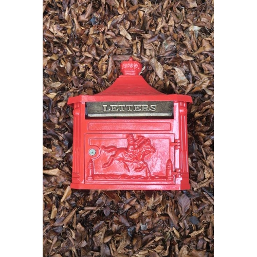 836 - A CAST METAL RED PAINTED WALL MOUNTED POST BOX with coronation finial and brass letter flap above a ... 