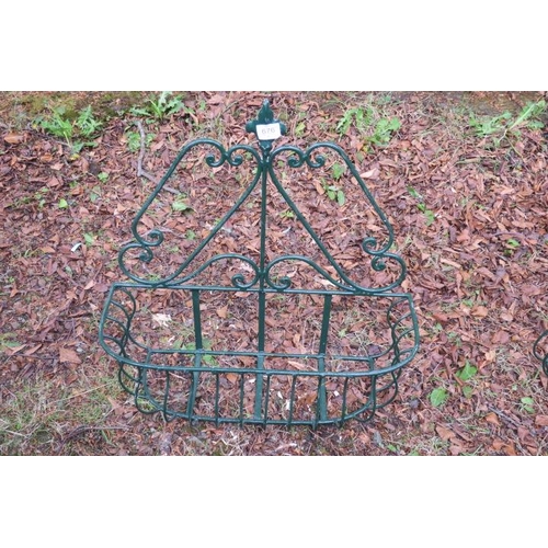 838 - A WROUGHT IRON WALL MOUNTED PLANTER of rectangular outline with scroll decoration with fleur de lis ... 