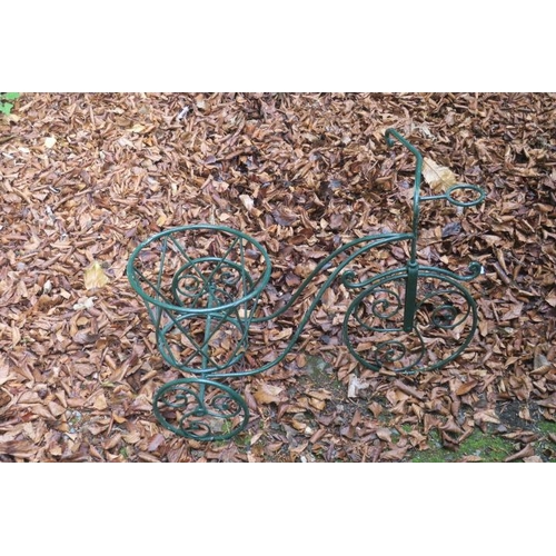 839 - A WROUGHT IRON PLANTER in the form of a three wheel bicycle with scroll decoration 60cm (h) x 80cm (... 