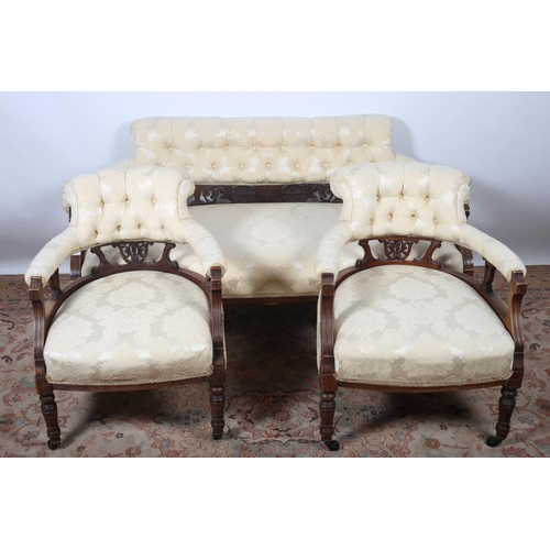 84 - A THREE PIECE EDWARDIAN MAHOGANY DRAWING ROOM SUITE comprising pair of tub shaped chairs each with a... 