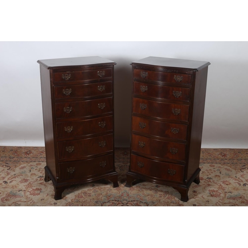 92 - A PAIR OF GEORGIAN DESIGN MAHOGANY TALLBOYS each of serpentine outline the shaped tops above six lon... 