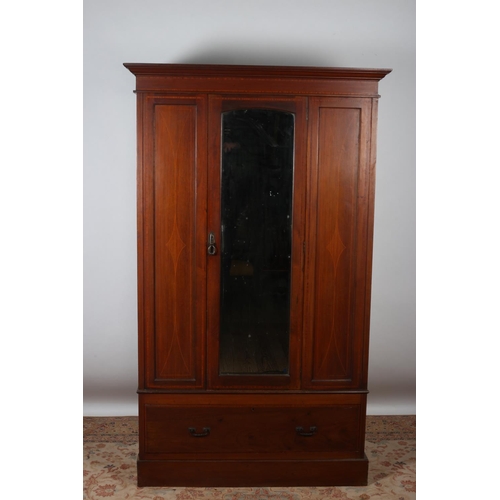 98 - A VINTAGE MAHOGANY AND SATINWOOD INLAID WARDROBE the moulded cornice above a bevelled glass mirrored... 