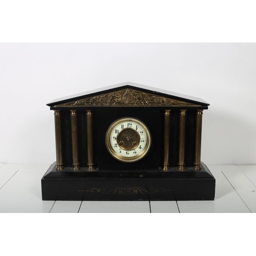 115 - A VINTAGE BLACK SLATE AND GILT BRASS MANTEL CLOCK of architectural outline 35cm (h) x 52cm (w) x 16c... 