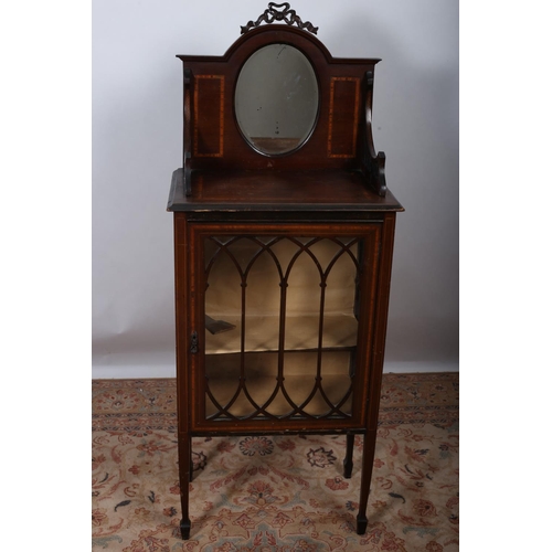 12 - AN EDWARDIAN MAHOGANY AND SATINWOOD INLAID DISPLAY CABINET the superstructure with oval bevelled gla... 