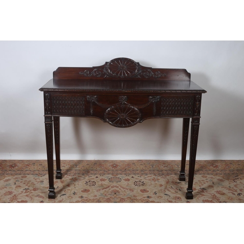 14 - A HEPPLEWHITE DESIGN MAHOGANY SIDE TABLE of rectangular bowed outline the carved back above three fr... 