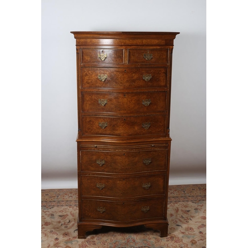 2 - A GEORGIAN DESIGN WALNUT CHEST ON CHEST of serpentine outline the shaped top above two short and thr... 