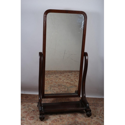 35 - A VICTORIAN MAHOGANY CHEVAL MIRROR the rectangular moulded frame with plate glass mirror raised on s... 