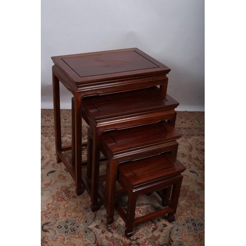 4 - A NEST OF QUARTETTO CHINESE HARDWOOD TABLES each of rectangular form on moulded legs joined by cross... 