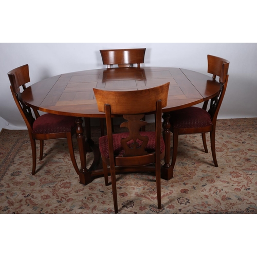 5 - A FIVE PIECE CHERRYWOOD DINING ROOM SUITE comprising four chairs each with a curved top rail with pi... 