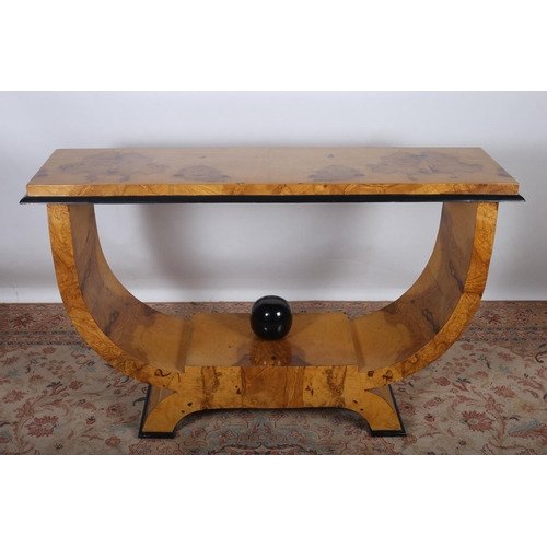 50 - AN ART DECO DESIGN WALNUT AND EBONISED CONSOLE TABLE of rectangular outline the shaped top raised in... 