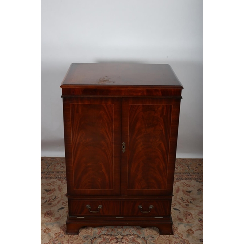 6 - A MAHOGANY CABINET of rectangular outline the shaped top above a pair of cupboards the base with one... 