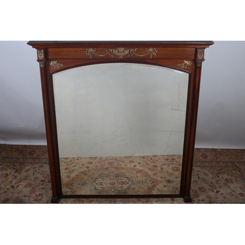 689 - A 19TH CENTURY EMPIRE DESIGN MAHOGANY AND GILT BRASS MOUNTED OVERMANTEL MIRROR the rectangular arche... 